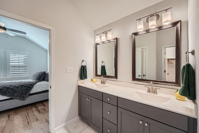 107 Lemuel Crawford Trl, Bastrop, TX 78602 - full bathroom featuring lofted ceiling, double vanity, ensuite bath, and ceiling fan