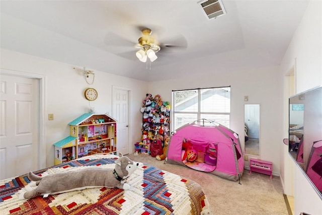 carpeted bedroom with visible vents and ceiling fan