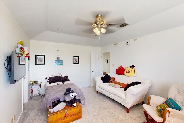 bedroom featuring a ceiling fan, visible vents, baseboards, lofted ceiling, and light colored carpet