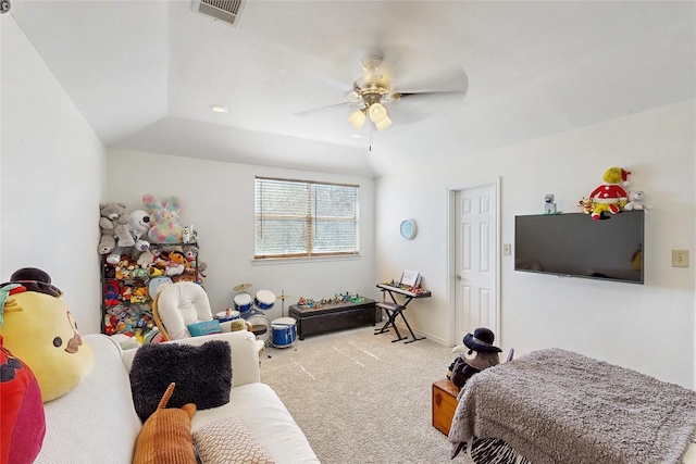 carpeted bedroom with lofted ceiling, visible vents, and ceiling fan