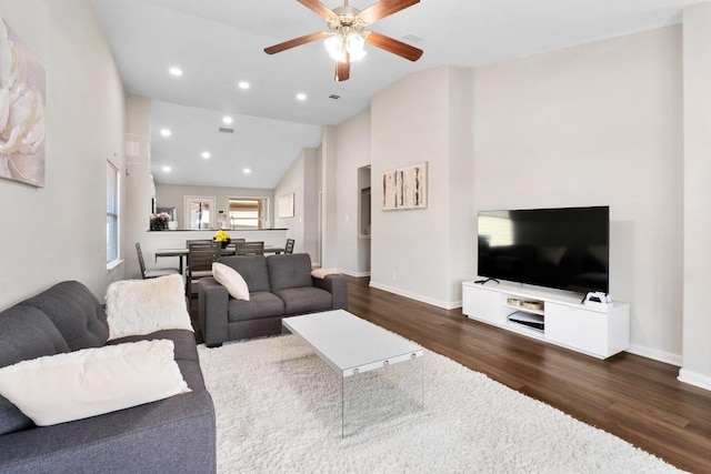 living room with high vaulted ceiling, wood finished floors, recessed lighting, baseboards, and ceiling fan