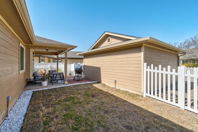 view of yard with a patio and fence