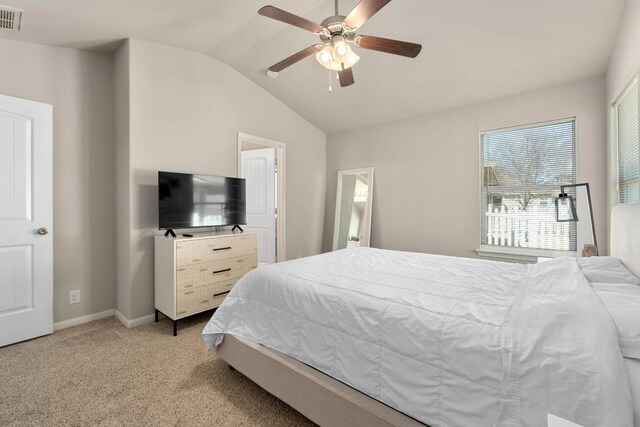 bedroom featuring visible vents, baseboards, ceiling fan, light colored carpet, and lofted ceiling