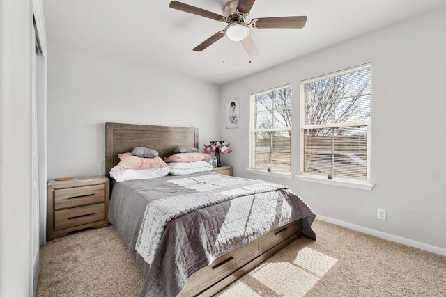 bedroom with carpet flooring, a ceiling fan, and baseboards