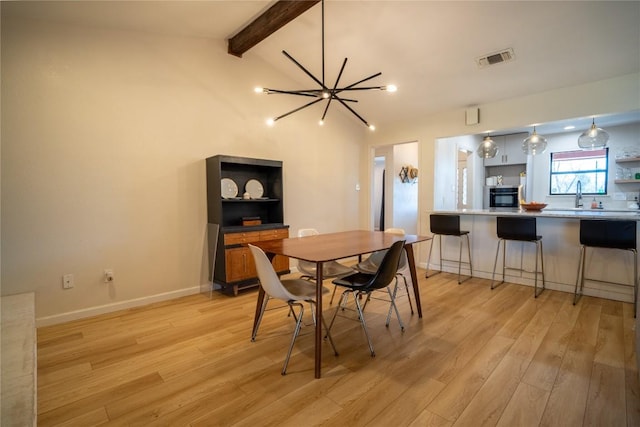 dining room featuring visible vents, vaulted ceiling with beams, baseboards, light wood-type flooring, and a notable chandelier