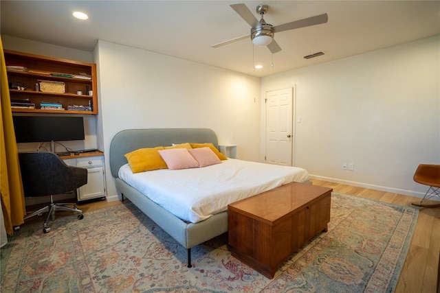 bedroom with baseboards, visible vents, light wood-style flooring, recessed lighting, and ceiling fan