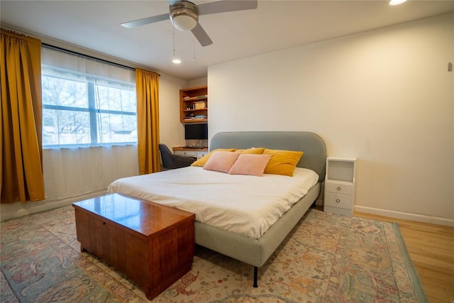 bedroom with recessed lighting, ceiling fan, baseboards, and wood finished floors