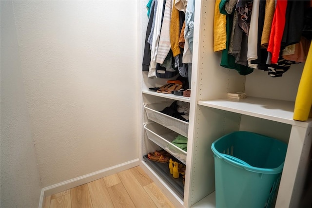 walk in closet featuring light wood-type flooring