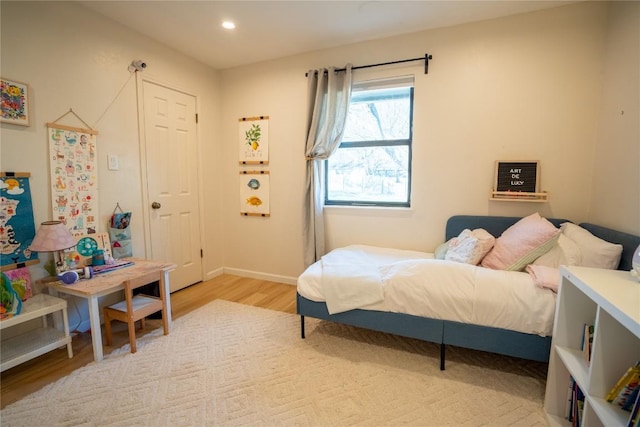 bedroom with recessed lighting, baseboards, and light wood-style floors