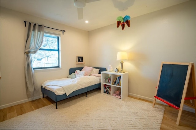 bedroom featuring recessed lighting, baseboards, and wood finished floors