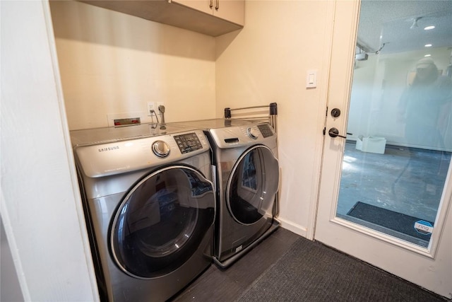 laundry room featuring dark wood-style floors and separate washer and dryer