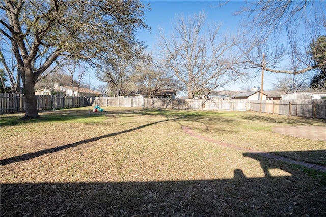 view of yard with a fenced backyard