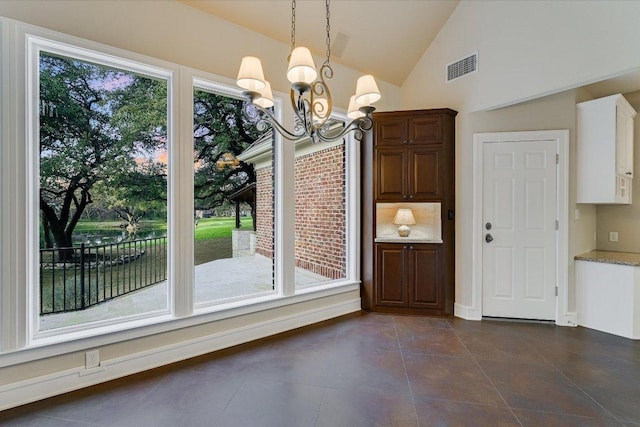 unfurnished dining area with an inviting chandelier, plenty of natural light, visible vents, and high vaulted ceiling