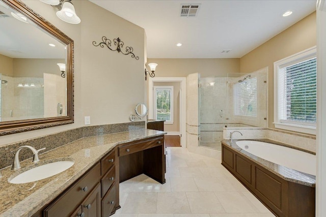 full bathroom with visible vents, tile patterned floors, a stall shower, a bath, and vanity