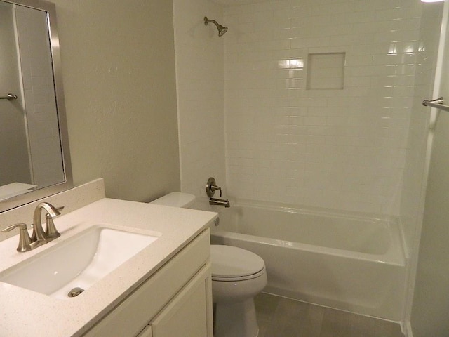 bathroom with bathtub / shower combination, toilet, and vanity