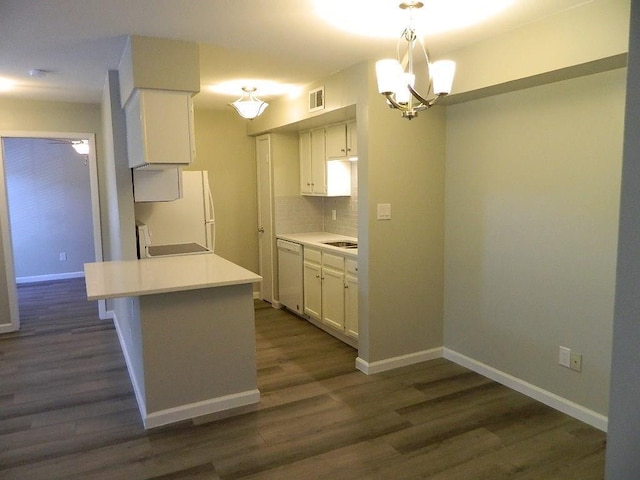 kitchen featuring tasteful backsplash, visible vents, white appliances, white cabinetry, and dark wood-style flooring