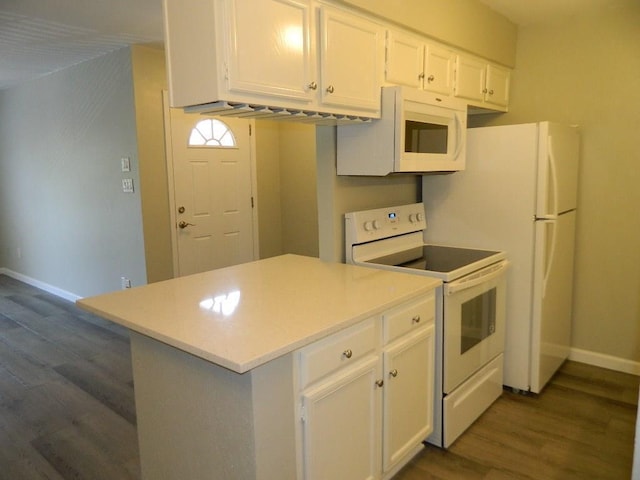 kitchen featuring dark wood-type flooring, white appliances, white cabinets, light countertops, and baseboards