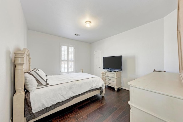 1000 Rutgers Dr, Pflugerville, TX 78660 - bedroom featuring dark wood-type flooring, baseboards, and visible vents
