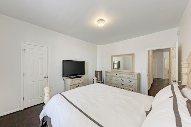 bedroom featuring dark wood-style flooring