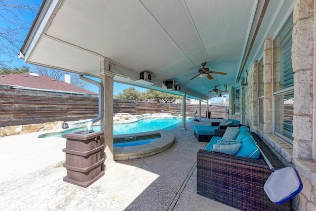 1000 Rutgers Dr, Pflugerville, TX 78660 - fenced backyard featuring a ceiling fan, a patio, an outdoor living space, and a pool with connected hot tub