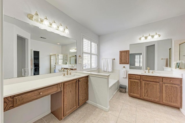 bathroom with tile patterned flooring, two vanities, a stall shower, and a sink