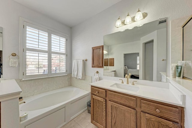 full bathroom featuring vanity, visible vents, ensuite bath, tile patterned flooring, and a garden tub