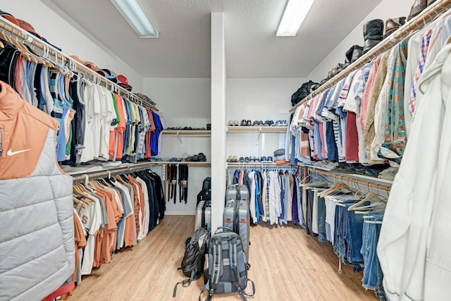 1000 Rutgers Dr, Pflugerville, TX 78660 - walk in closet featuring wood finished floors