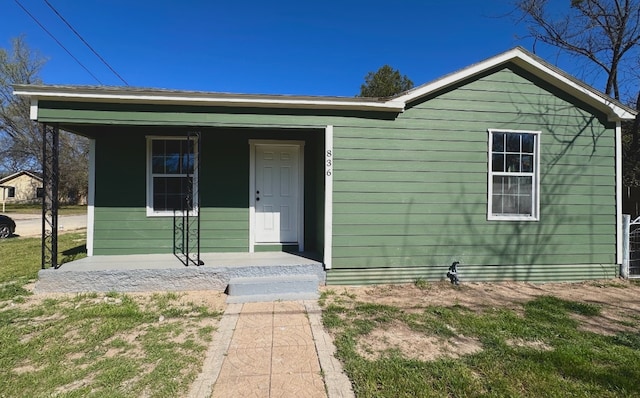 doorway to property featuring covered porch