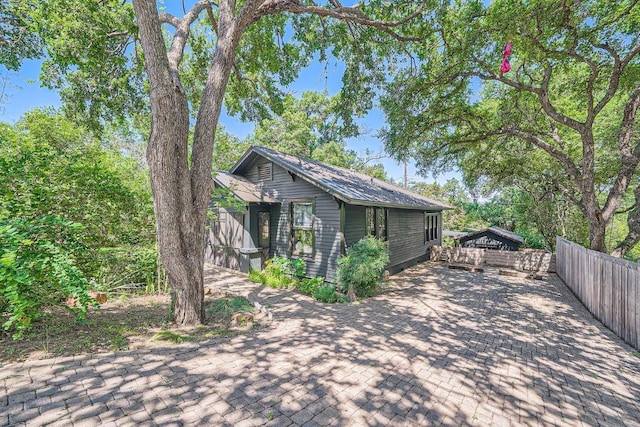 view of home's exterior featuring fence