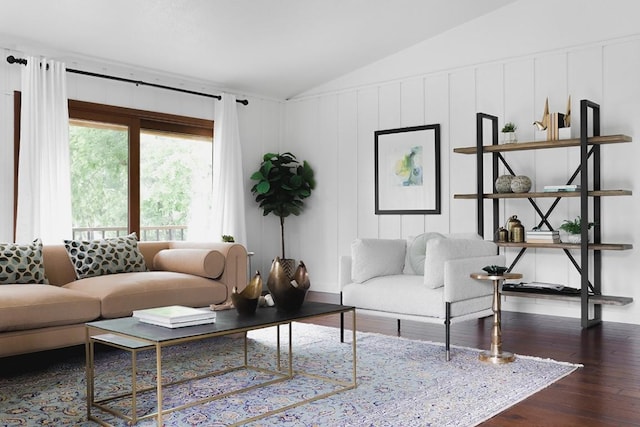 living area with lofted ceiling and wood finished floors