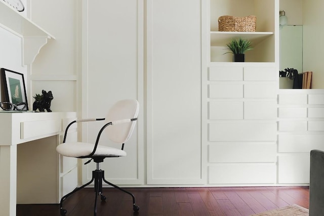 interior space with open shelves and dark wood-style flooring