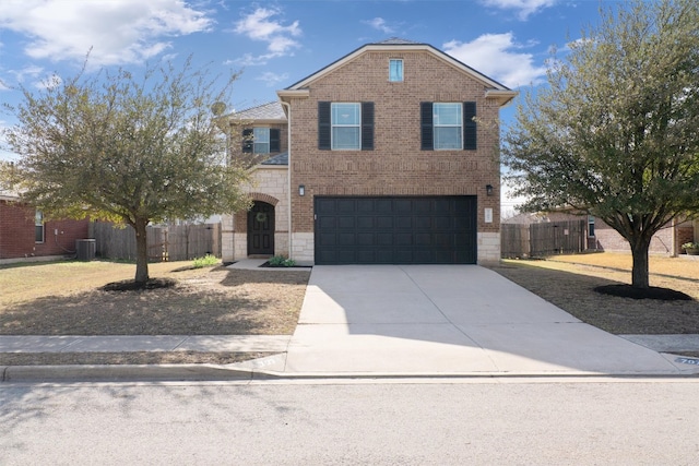 traditional home with fence, driveway, stone siding, a garage, and brick siding