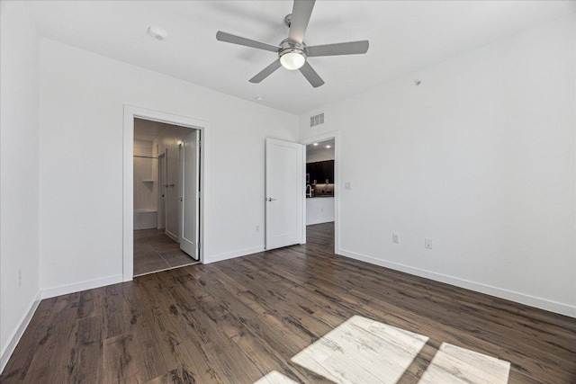 unfurnished bedroom featuring ceiling fan, visible vents, baseboards, and wood finished floors