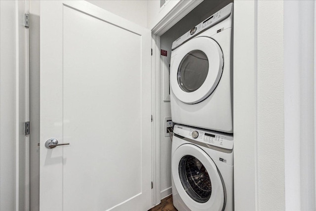 washroom featuring laundry area and stacked washer and clothes dryer