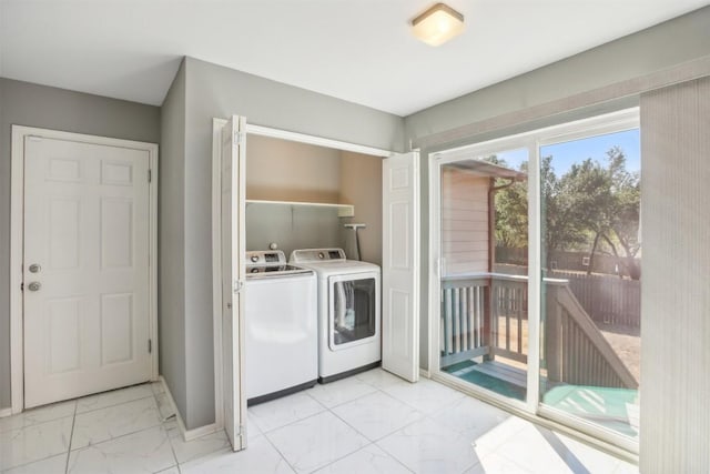 1505 Curameng Cv, Austin, TX 78748 - laundry area featuring light marble finish floors and washing machine and clothes dryer