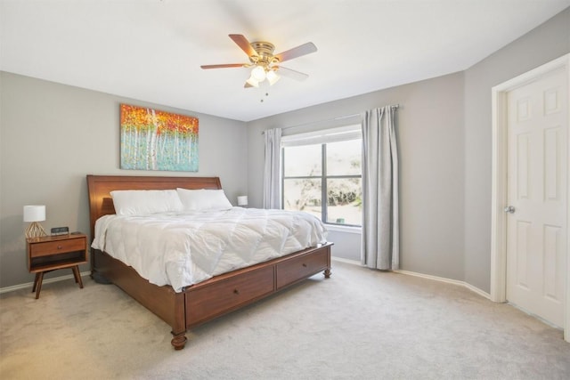 carpeted bedroom featuring a ceiling fan and baseboards