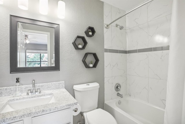 bathroom with shower / tub combo with curtain, toilet, vanity, and a textured wall