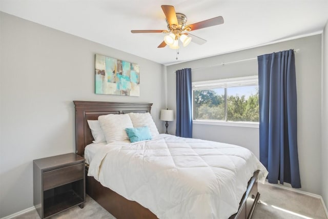 bedroom with a ceiling fan, carpet, and baseboards