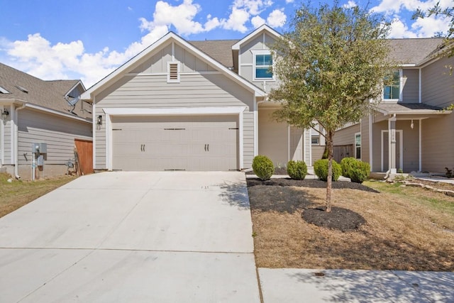 view of front of home with a garage, board and batten siding, and concrete driveway