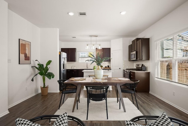 dining space with recessed lighting, baseboards, visible vents, and dark wood-style floors