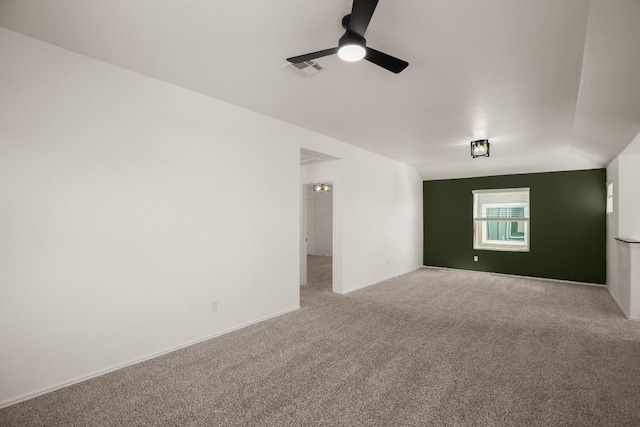 unfurnished room with ceiling fan, carpet flooring, and visible vents