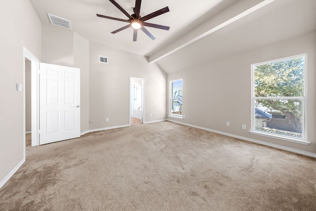 carpeted spare room featuring high vaulted ceiling, baseboards, visible vents, and ceiling fan