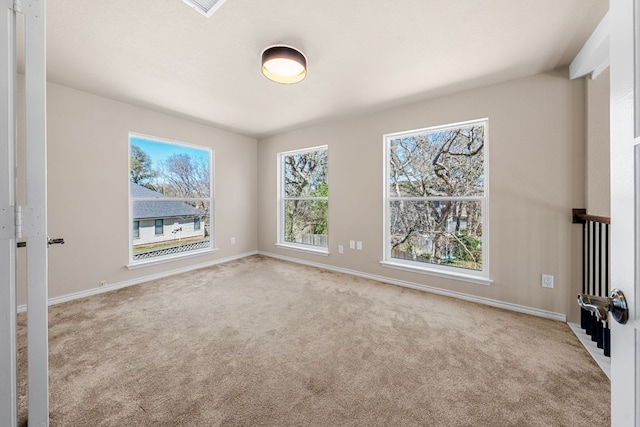 empty room with carpet flooring and baseboards