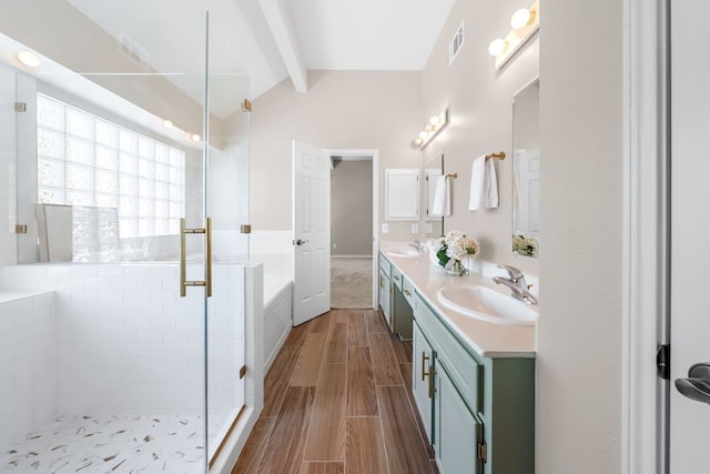 bathroom with a stall shower, vaulted ceiling with beams, visible vents, and a sink