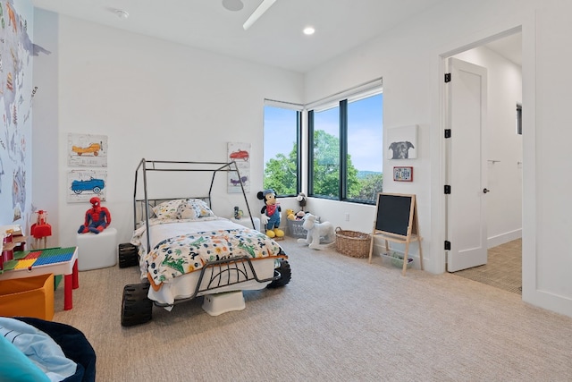 carpeted bedroom with recessed lighting