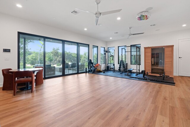 workout area with recessed lighting, light wood-style flooring, visible vents, and ceiling fan