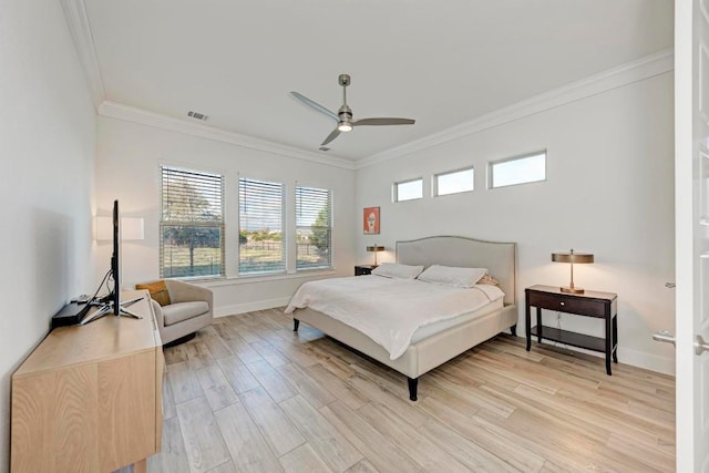 bedroom with light wood-style flooring, ornamental molding, ceiling fan, baseboards, and visible vents