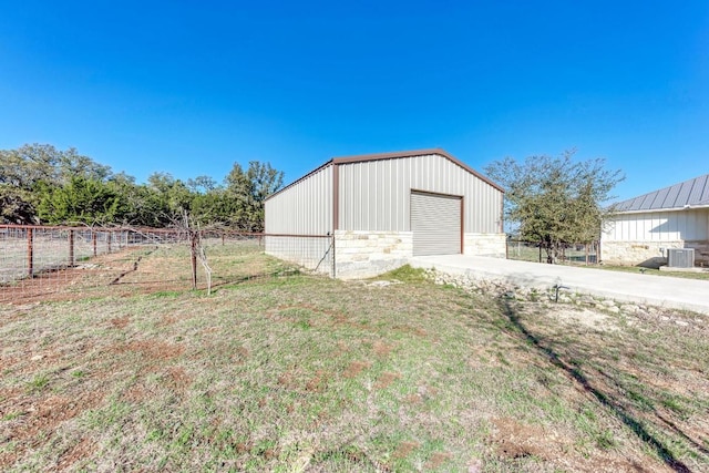 exterior space with fence, a yard, and concrete driveway