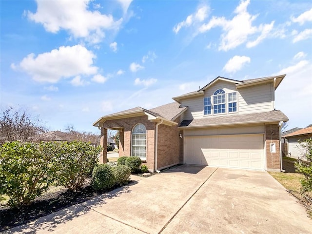 3128 Flinders Reef Ln, Austin, TX 78728 - traditional-style house featuring driveway, brick siding, an attached garage, and roof with shingles