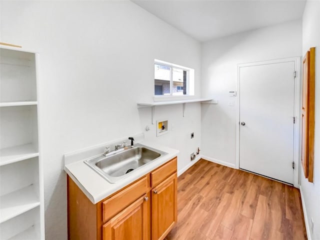 3128 Flinders Reef Ln, Austin, TX 78728 - laundry room featuring electric dryer hookup, washer hookup, cabinet space, hookup for a gas dryer, and light wood-style floors